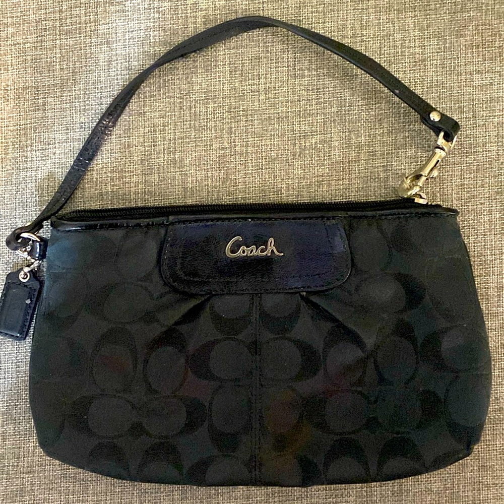Black authentic Coach wristlet with strap